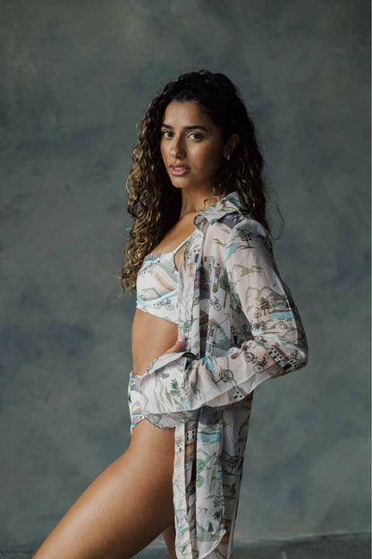 Model wearing beach shirt standing sideways